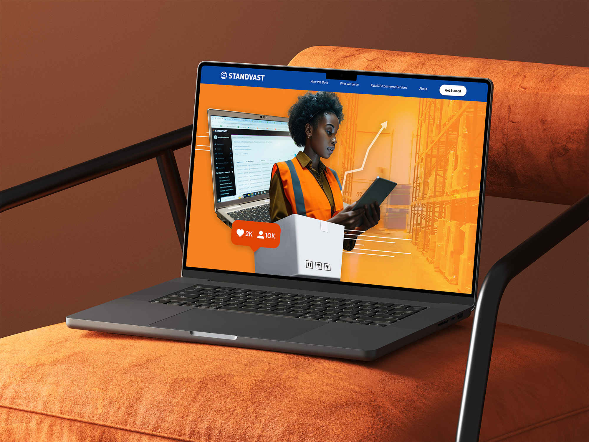 photograph of a laptop on an orange velvet chair displaying standvast website with the new visual style
